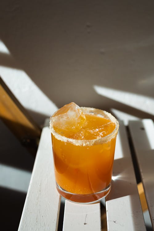 Close-Up Shot of an Alcoholic Beverage on a Shot Glass