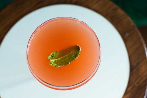 Close-Up Shot of a Cocktail Drink on a White Plate 