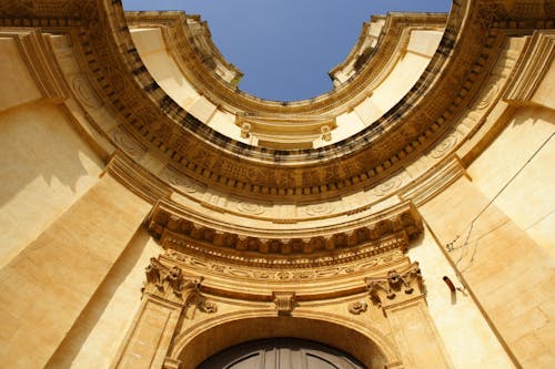 Low Angle Photo of Brown Concrete Ruins Under Clear Blue Sky