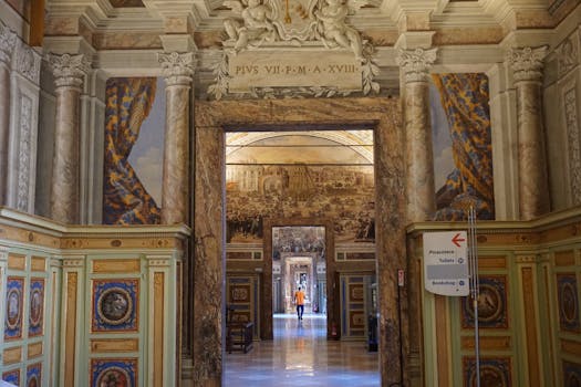 Intricate hallway in the Apostolic Palace, featuring ornate marble columns and artwork.