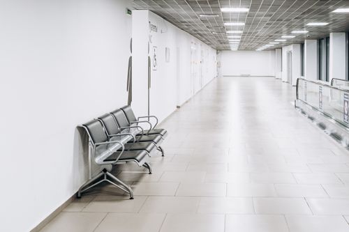 Free Modern empty large white hall of terminal with luminous bright lamps on ceiling Stock Photo