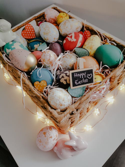 Free Assorted Colored Eggs on Brown Woven Basket Stock Photo