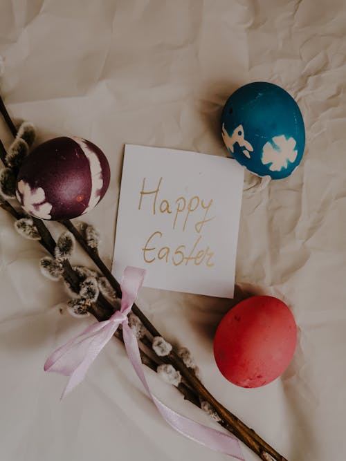 Close-Up Shot of Easter Eggs with a Happy Easter Card