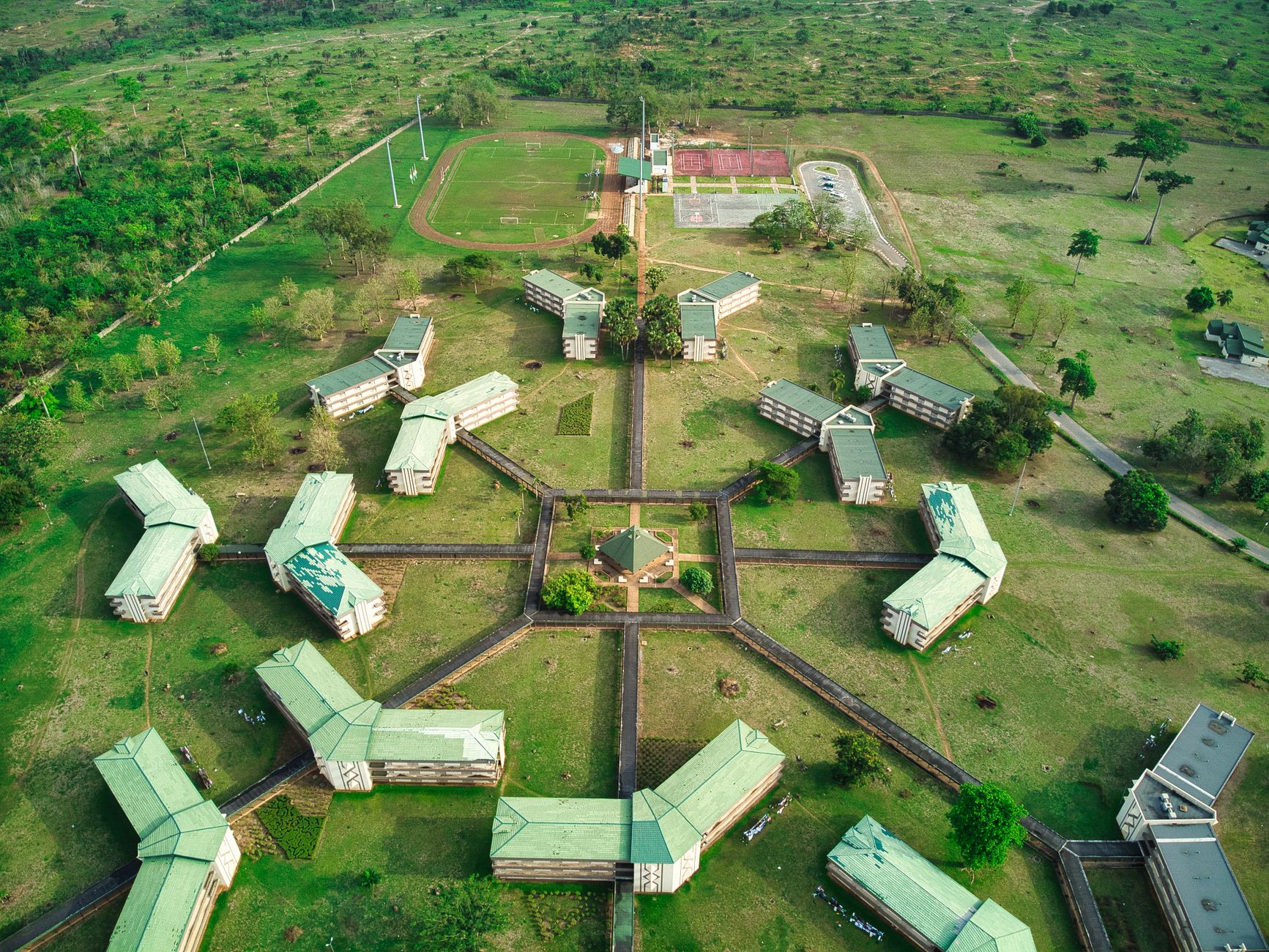 Drone shot of university buildings and sports fields in Yamoussoukro, Côte d'Ivoire.