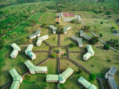 Drone shot of university buildings and sports fields in Yamoussoukro, Côte d'Ivoire.