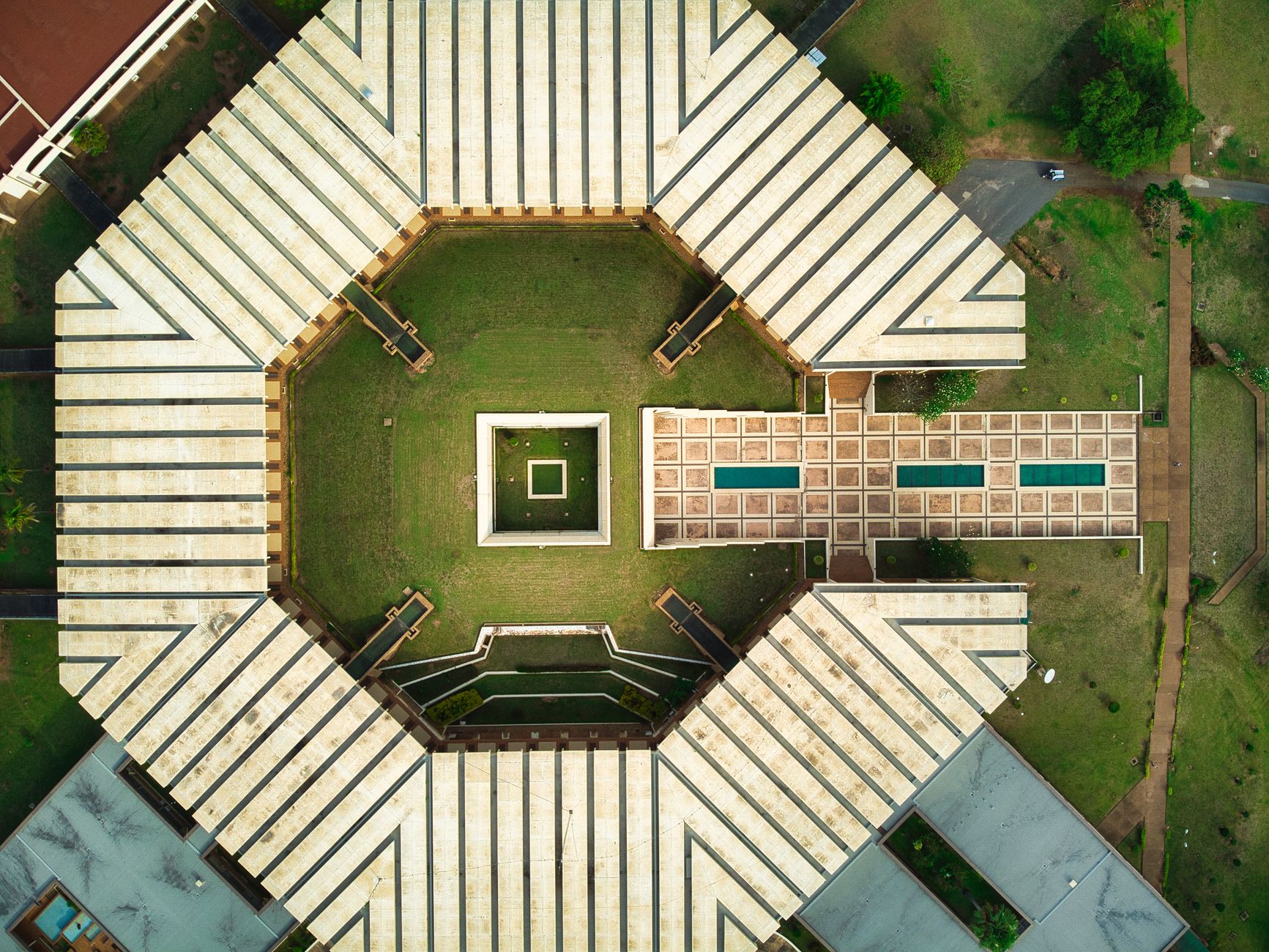 Stunning aerial drone shot of a hexagonal building in Yamoussoukro, Côte d'Ivoire.
