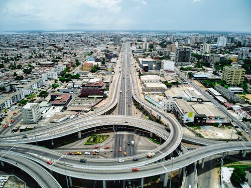 Free Aerial View of Flyover Roads and Highways on a Metropolitan Area Stock Photo