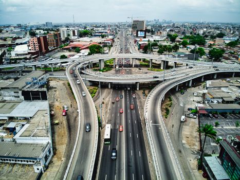 High-angle view of a busy expressway in Abidjan, showcasing urban infrastructure and traffic.