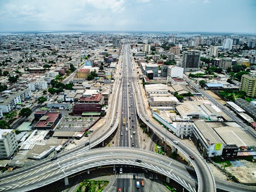 Free Aerial View of Flyover Roads and Highways on a Metropolitan Area Stock Photo