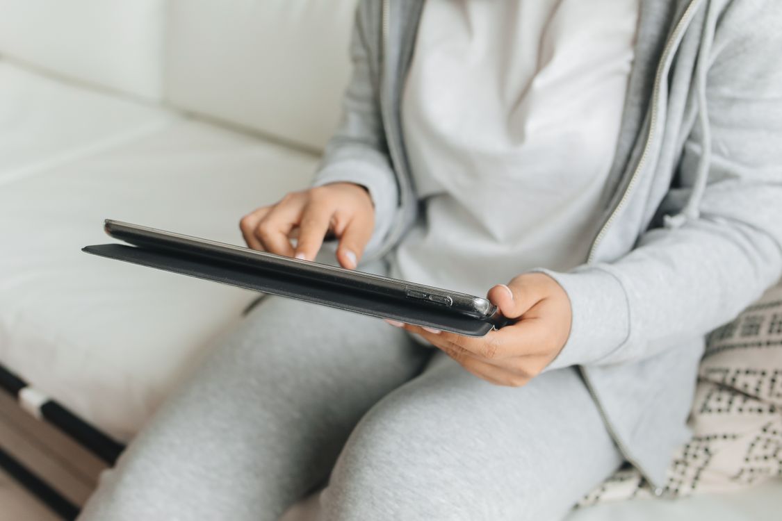 Close-Up Shot of a Person Using a Tablet · Free Stock Photo