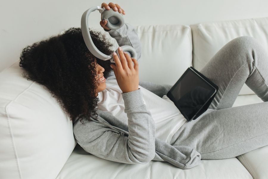 A student listening to a course on headphones — photo by Polina Tankilevitch on Pexels