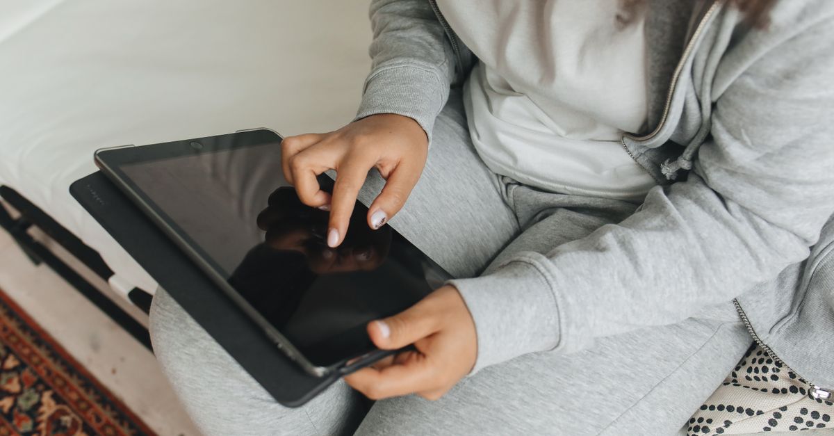 Human Using Tab Close-Up Shot of a Person Using a Tablet · Free Stock Photo