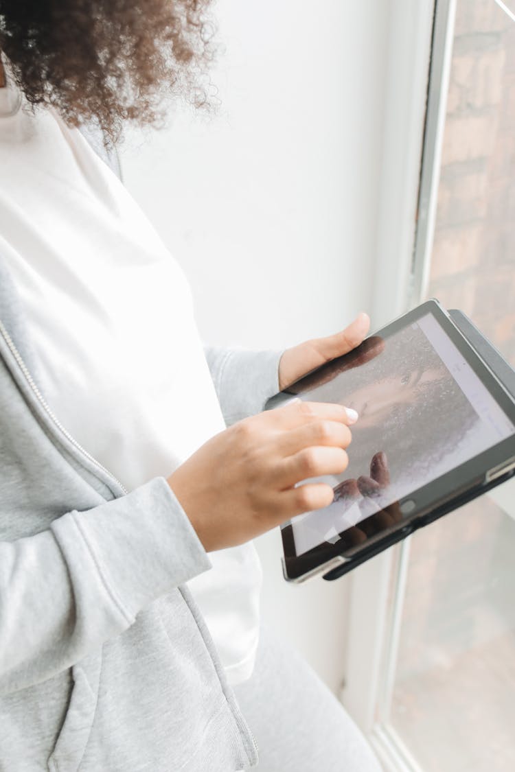 Close-Up Shot Of A Person Using An Ipad