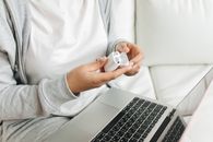 Person Holding an Earphone