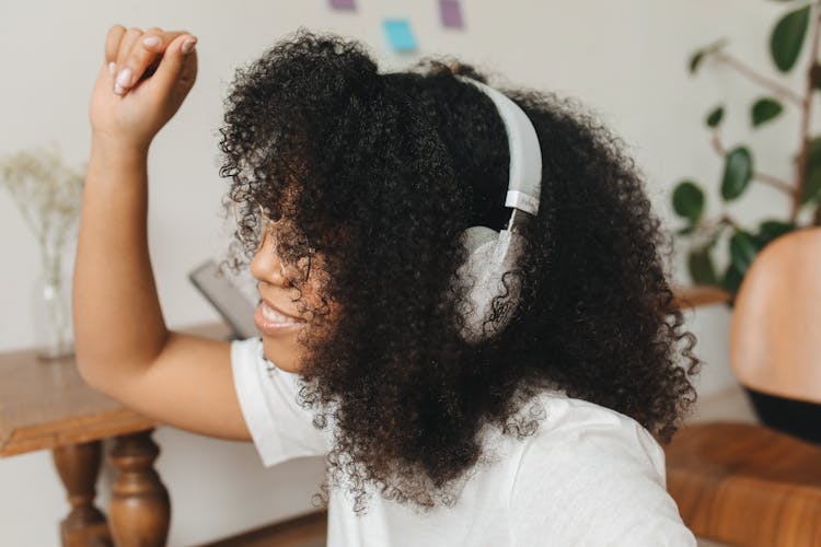 A Woman Enjoying Listening To Music