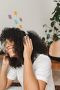 Woman in White T-shirt Covering Her Face With Her Hair