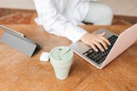 Person in White Dress Shirt Using Macbook Pro