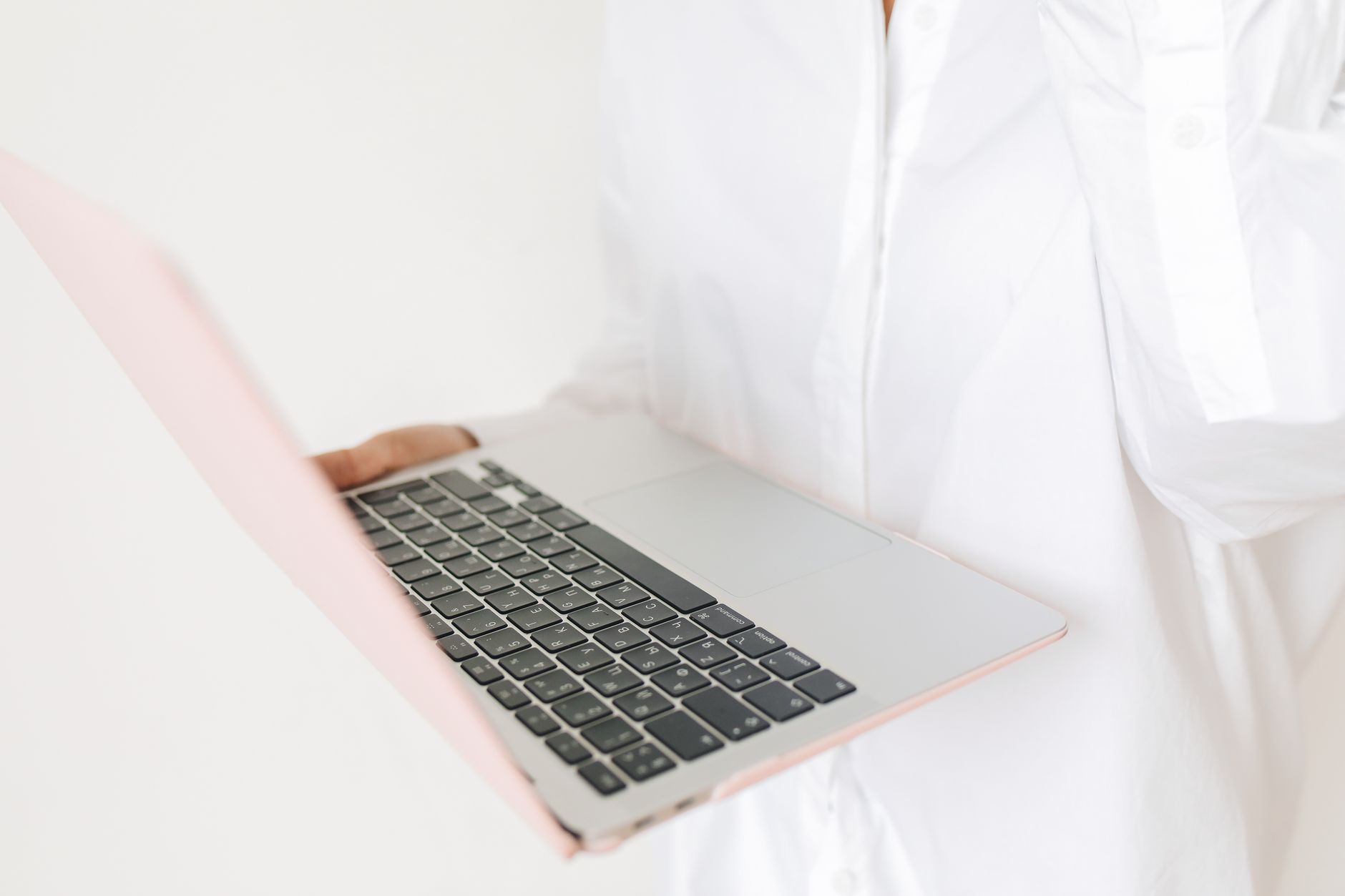 A calm bettor closing a laptop beside a completed budget sheet and untouched emergency savings envelope