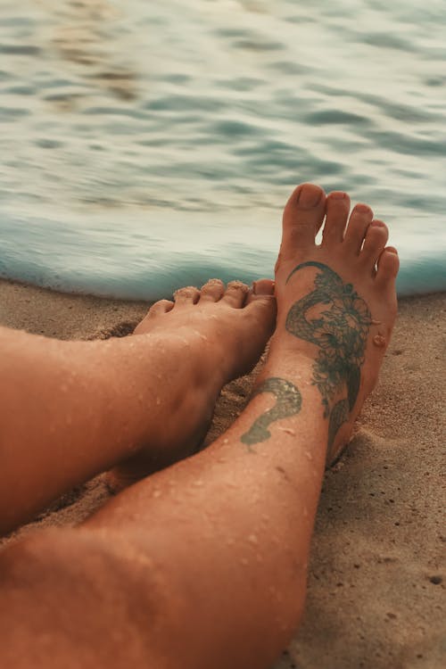 Free A Person's Foot with Tattoo Stock Photo