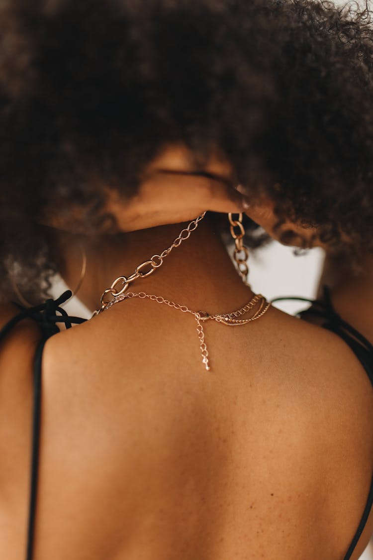 Woman Wearing Gold Chain Necklace