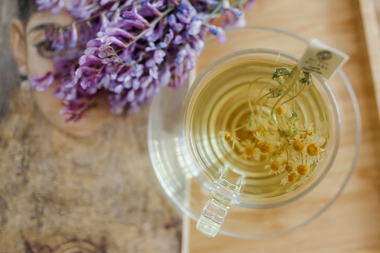 Warm caffeine free herbal tea served in a glass cup