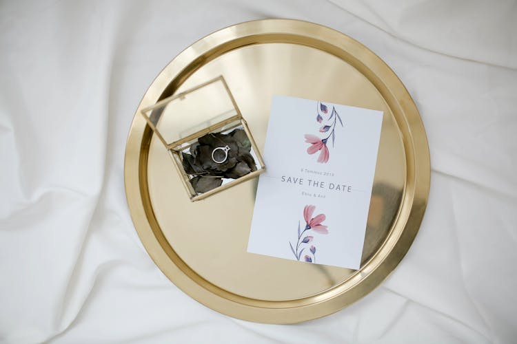 Engagement Ring And Invitation On A Gold Tray