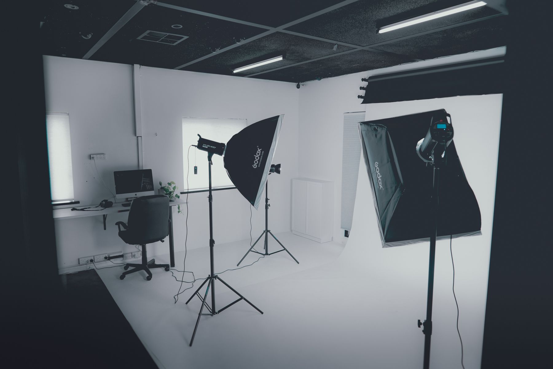 Studio workstation beside lighting equipment