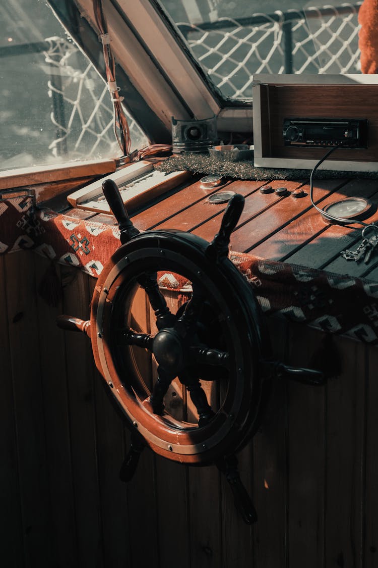 Captain Steering Wheel Inside A Boat