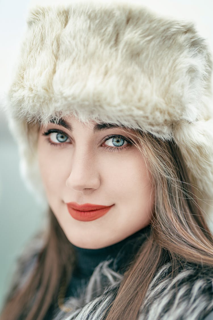 A Beautiful Woman Wearing An Ushanka Hat