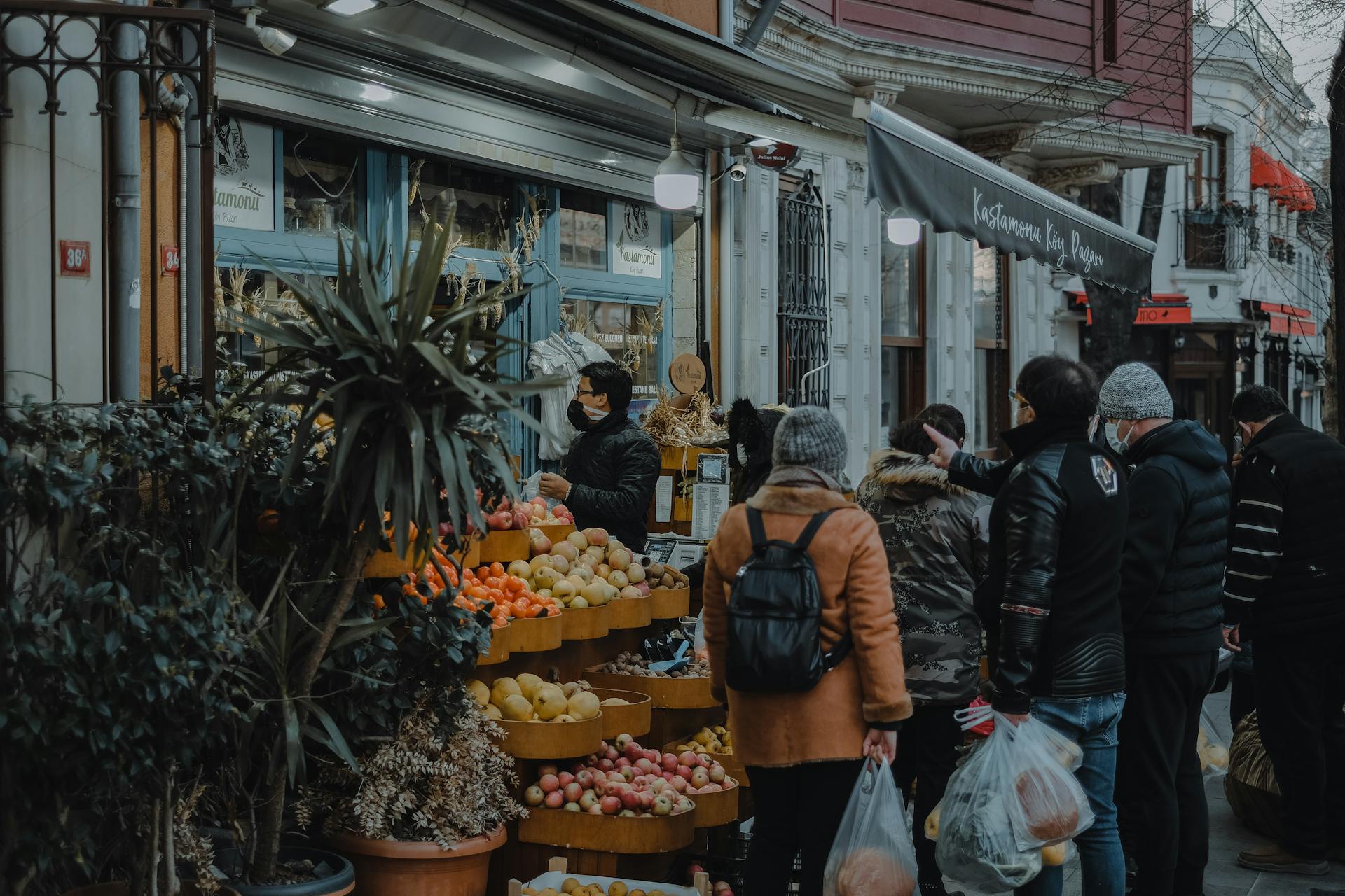 People Buying Assorted Produce at a Local Business