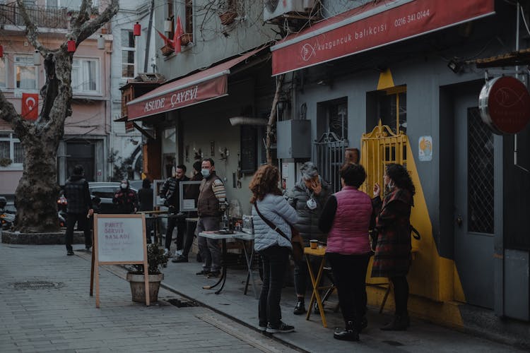 People Hanging Out At The Sidewalk