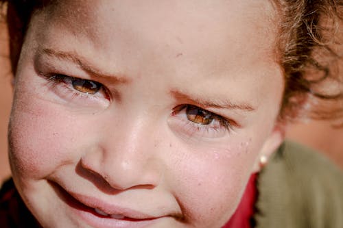 A Young Girl with a Worried Smile