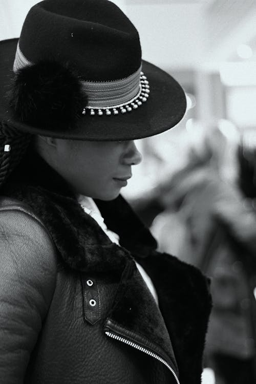 Grayscale Photo of a Person Wearing Fedora Hat