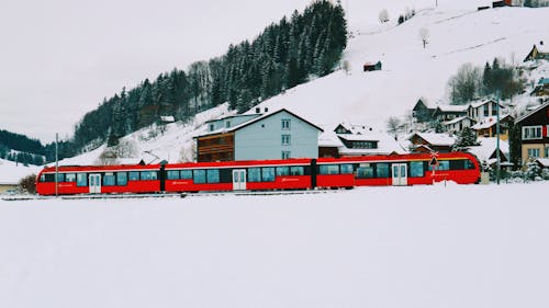 Red Train on Snow Covered Ground