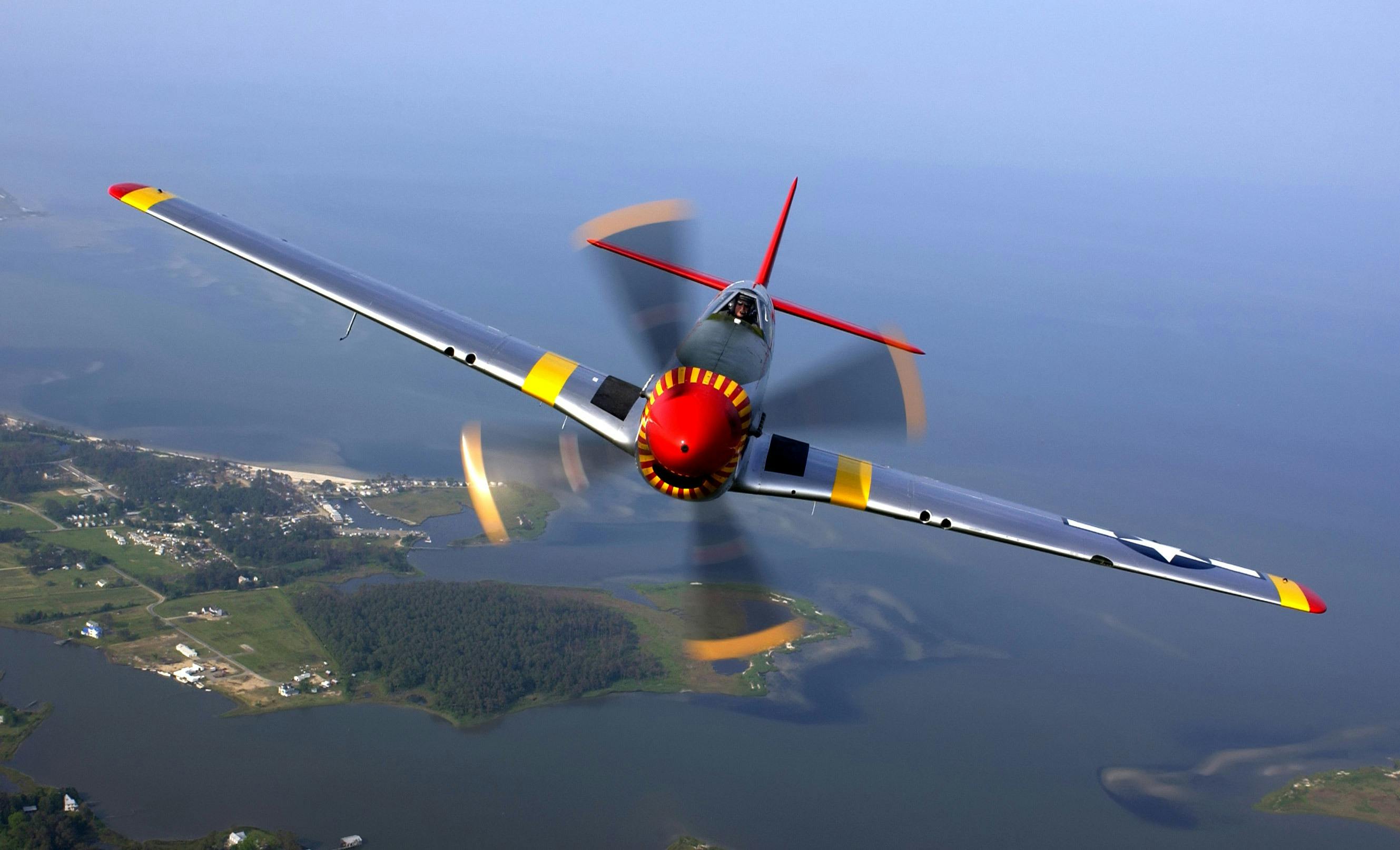 Silver Yellow Red and Black Jet Flying during Daytime \u00b7 Free Stock Photo