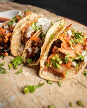 Authentic Mexican tacos with onions and cilantro, perfect for a gourmet culinary experience.