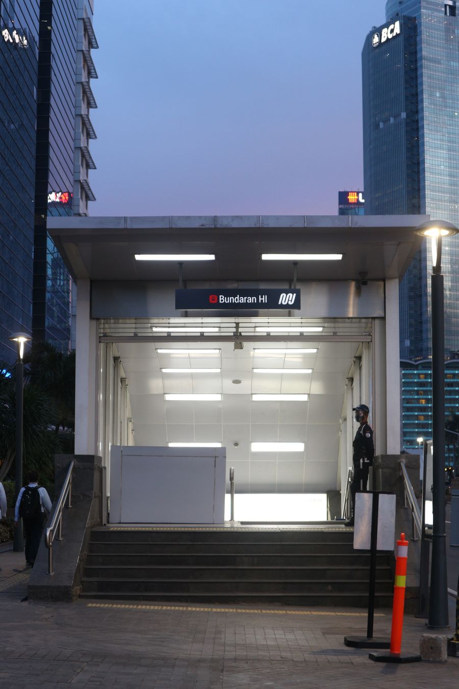 Security personnel controlling access at a building entrance