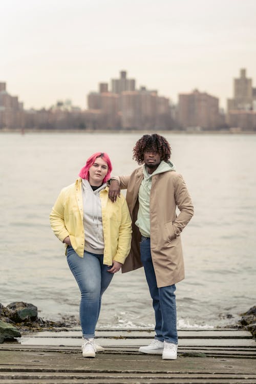 Free Diverse couple standing near river in city Stock Photo