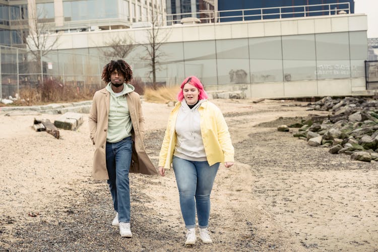 Multiethnic Couple Walking On Shore