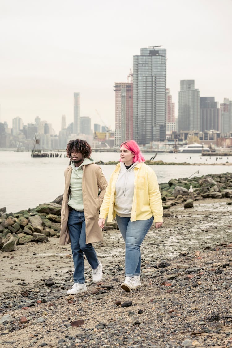 Diverse Couple Walking Along River