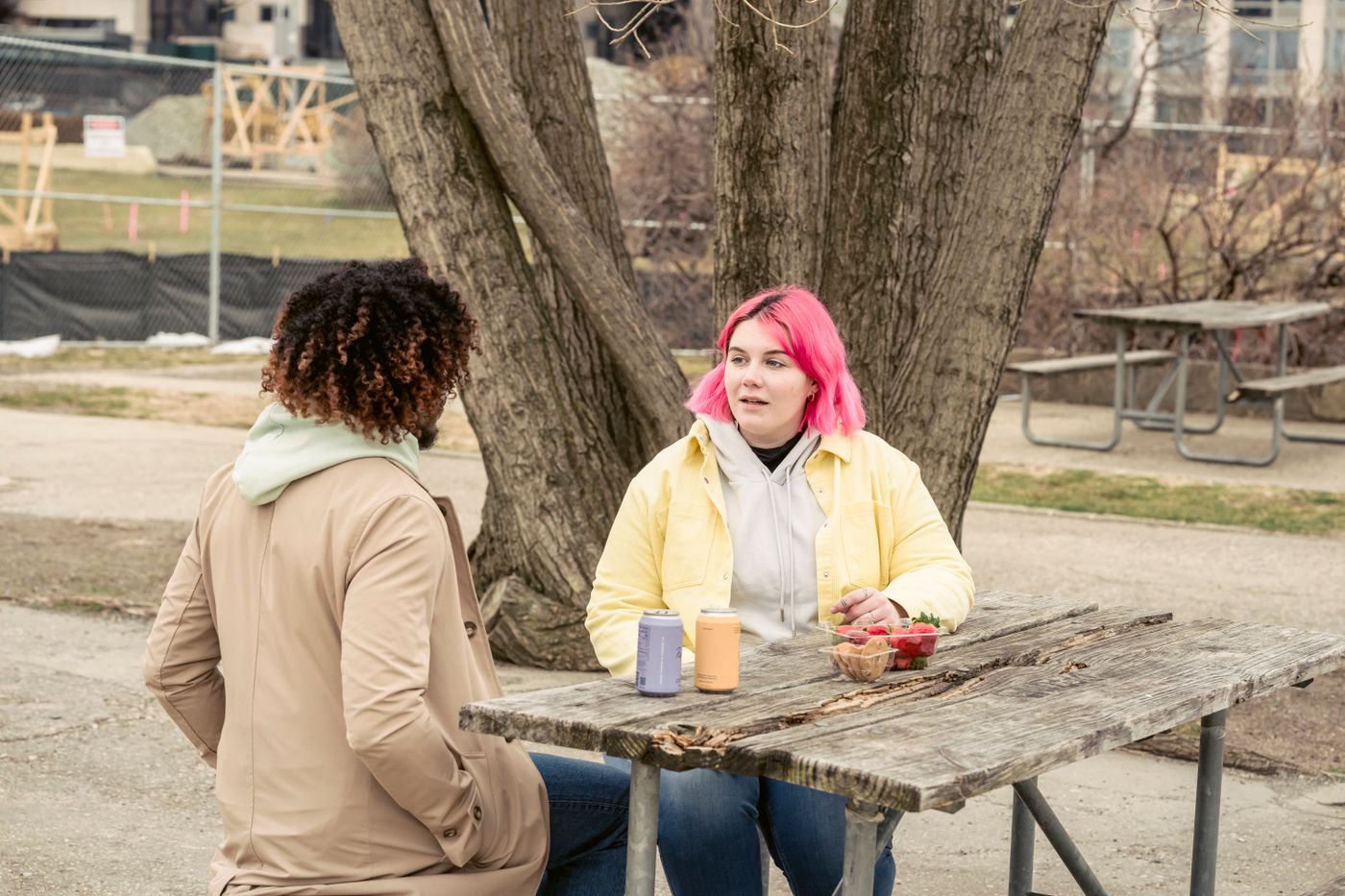 Two people in conversation at a table