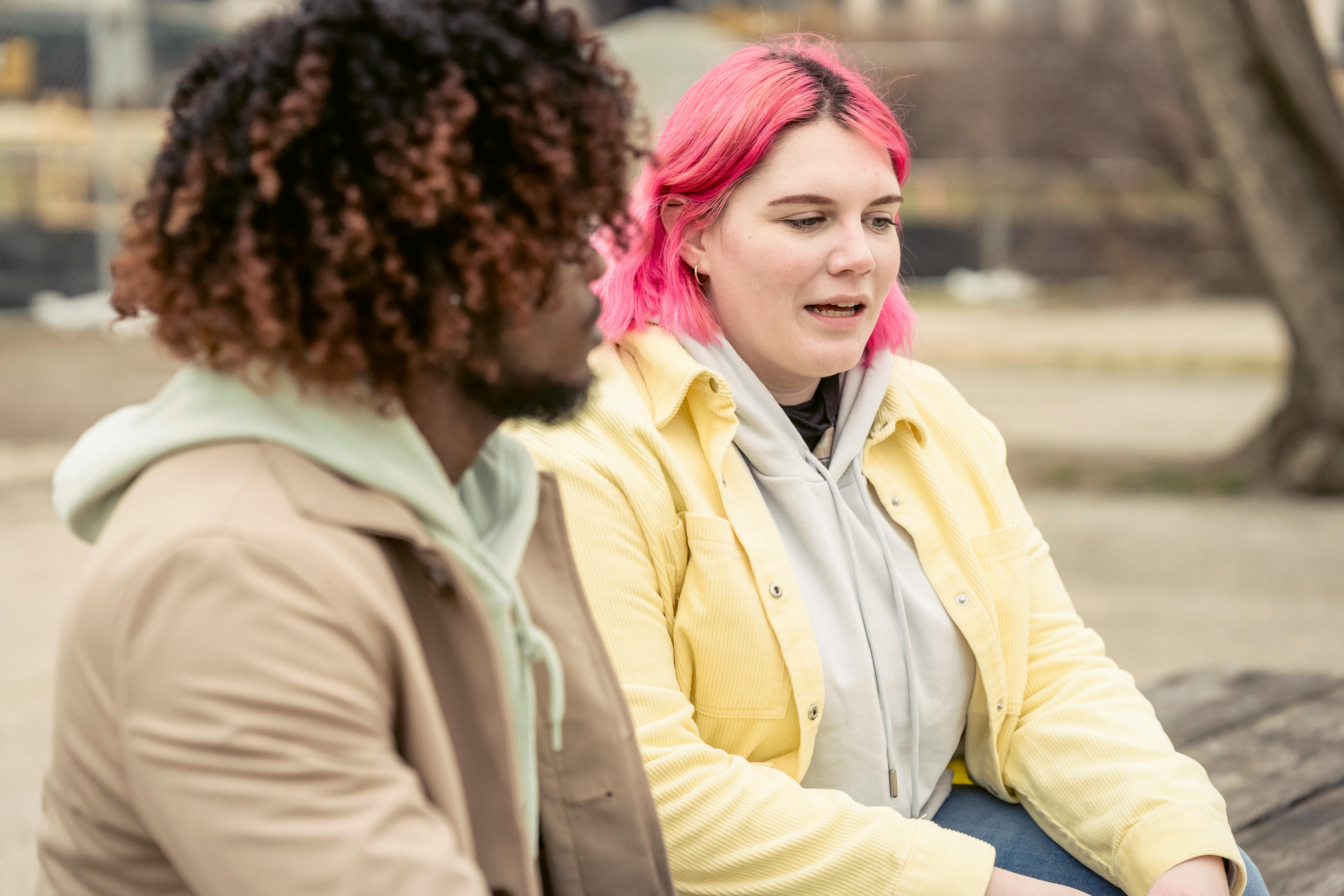 diverse couple chatting on street