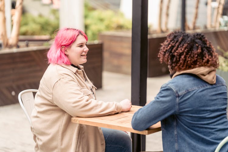 Friends Spending Time At An Al Fresco Dining Restaurant