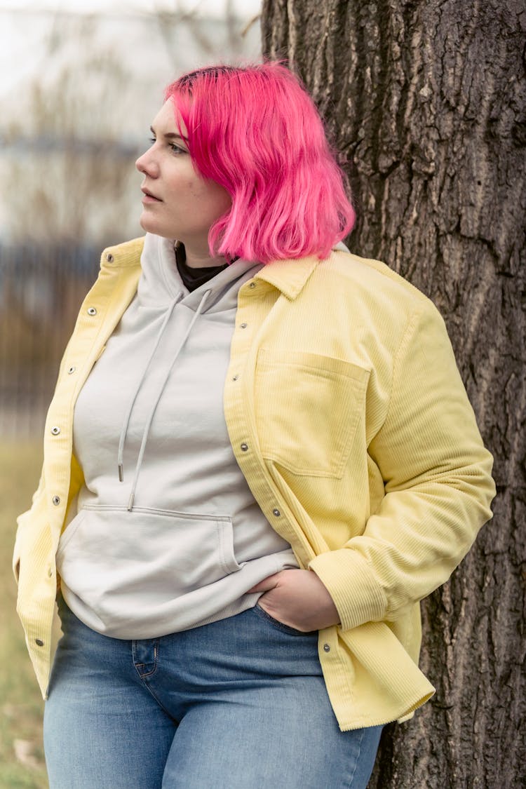 Plus Size Woman Leaning On Tree