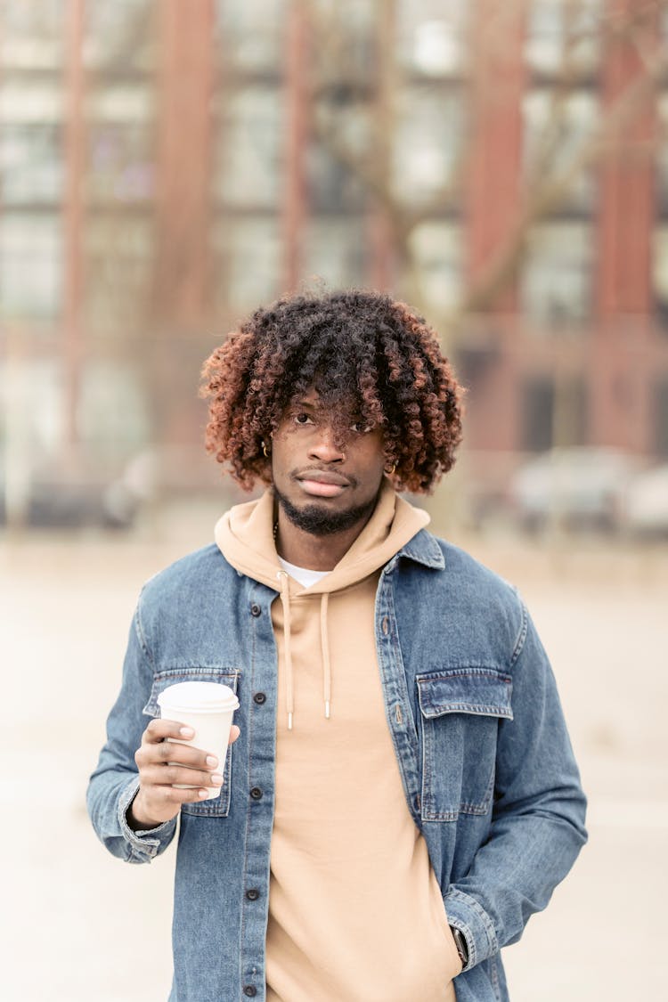 Black Man With Coffee To Go On Street