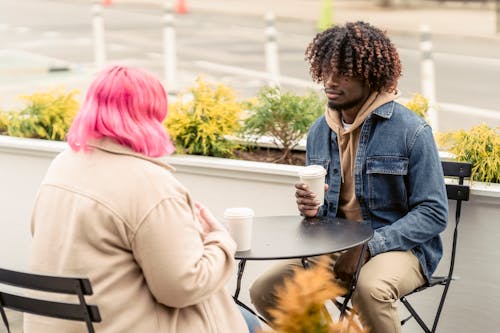 Multiracial friends drinking coffee in cafe