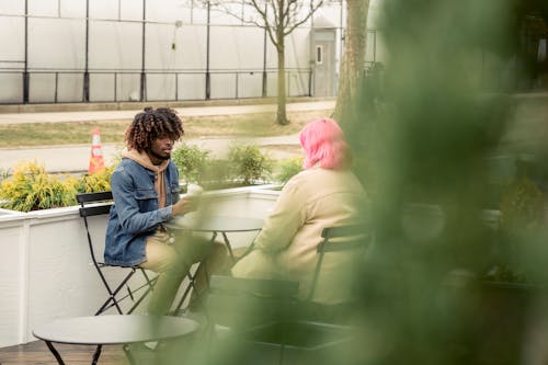 Free Multiracial friends in outdoor cafeteria Stock Photo