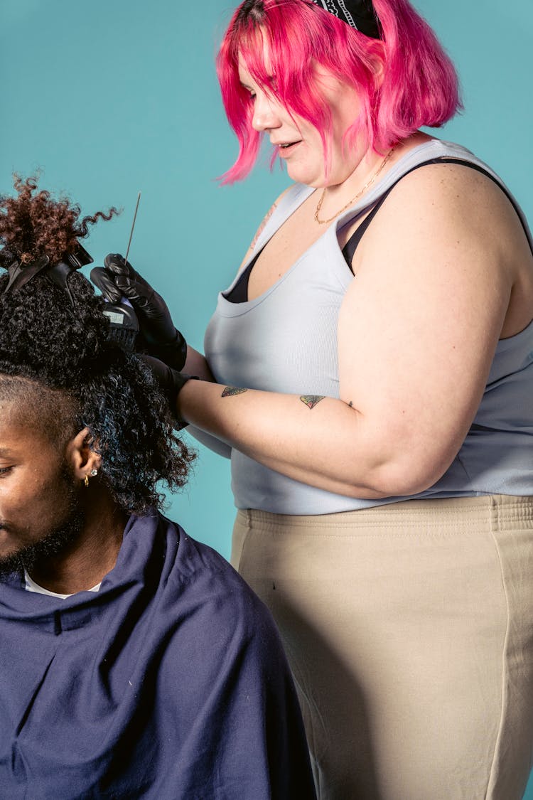 Plump Woman Dying Hair Of Black Man