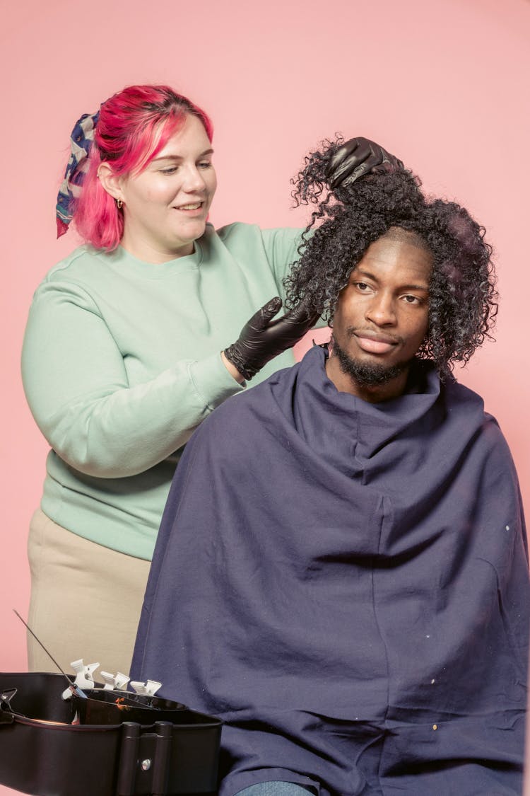 Positive Hairdresser Preparing Hair Of Black Man For Applying Dye