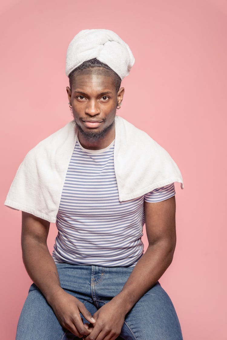 Serious Black Man In Towel Drying Hair In Studio